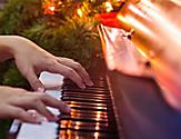 Hands Playing Piano Part of Caroling and Music on Christmas Cruises