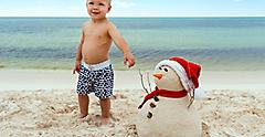 Holidays Mexico Cozumel Boy Building Snowman