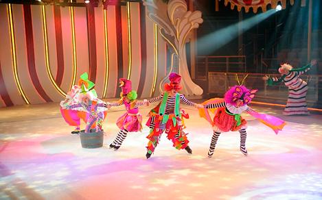 Clumsy Clowns skating on a brightly colored rink in ice skating show Ice Under the Big Top.