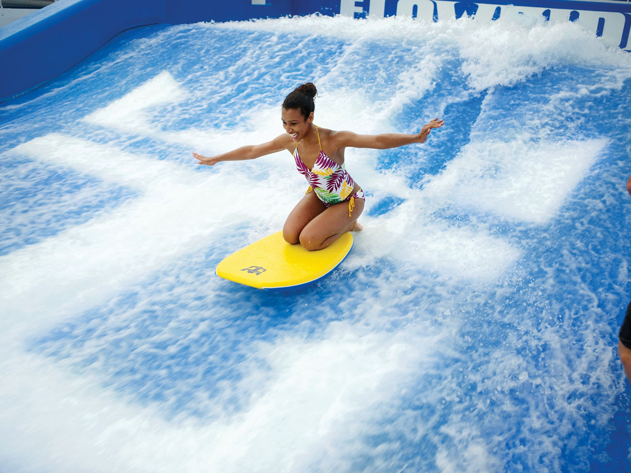 Woman Surfing on Flowrider 