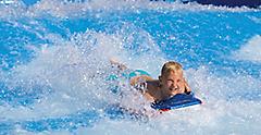 Harmony of the Seas Boy Body Surfing on Flowrider Laughing