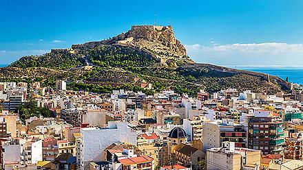 View of Alicante, Spain with the Santa Barbara castle on a hill looking over the city