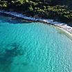 Aerial view of Kalamia beach with white rock formations and turquoise water of Argostoli, Greece