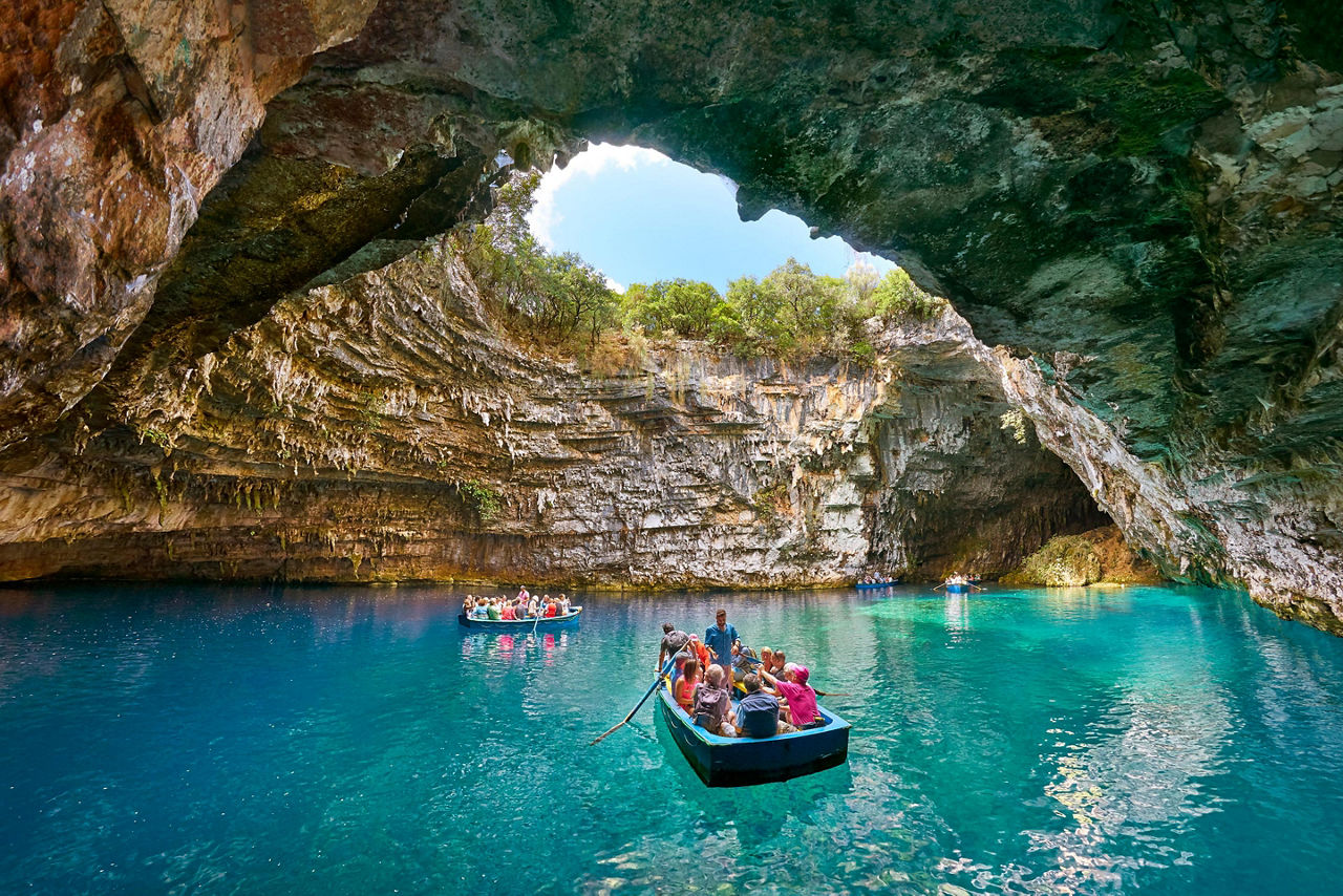 Tourist boat on the lake in Melissani Cave in Argostoli, Greece