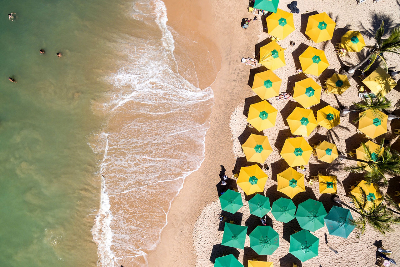 banana coast honduras tropical beach top view umbrellas
