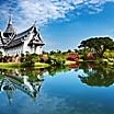 The Sanphet Prasat Palace with reflections along the water in the Ancient City of Bangkok, Thailand