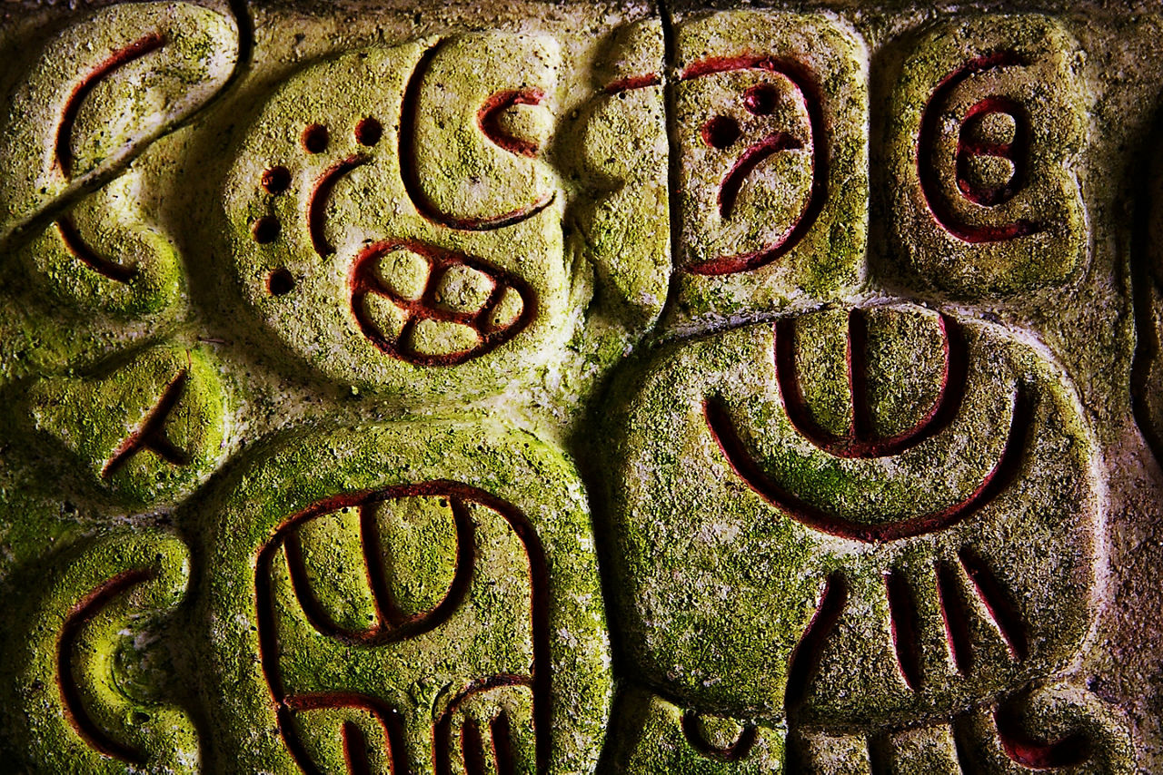 belize caracol mayan ruin engraving