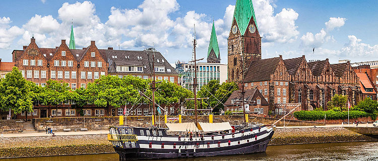 Historic town of Bremen with an old sailing ship on Weser river near Bremerhaven, Germany