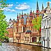 Old brick homes lining a canal in Bruges, Belgium