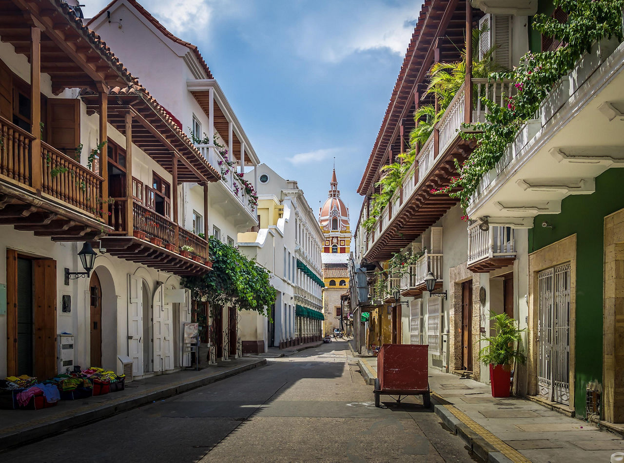 Buildings with balconies lining a street in Cartagena, Colombia