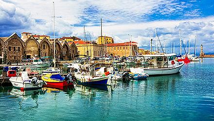 Boats docked at a pier in Chania, Crete