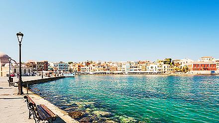 A panoramic view of the buildings lining the coast of Chania, Crete