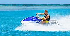Man Riding Jet Ski in Beautiful Blue Water, Coco Cay, Bahamas