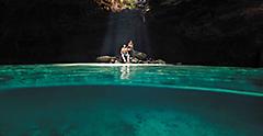 Couple on their Cruise Vacation Inside of a Cenote, Cozumel, Mexico 
