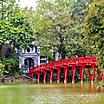 The red Huc Bridge in Hoan Kiem Lake, Hanoi, Vietnam