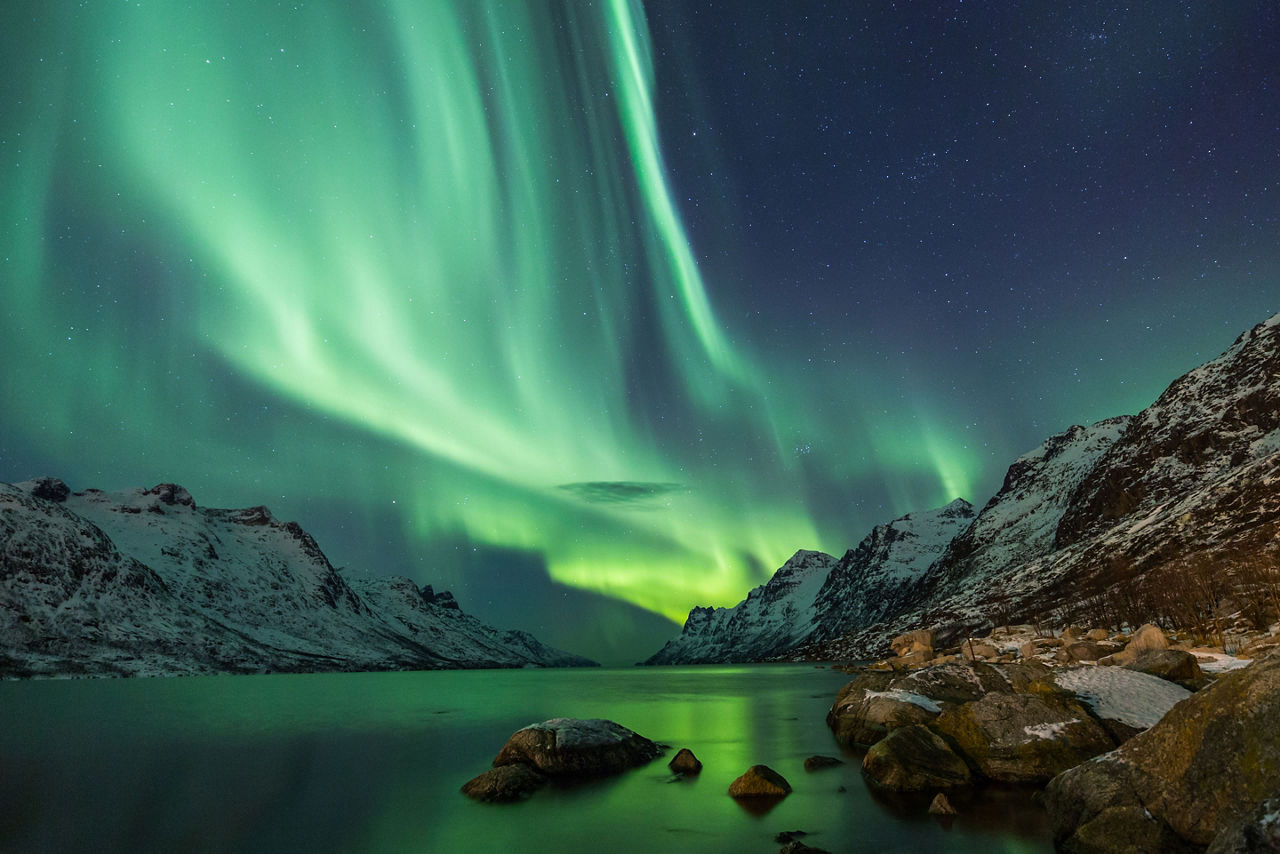 Northern lights over arctic terrain in Norway