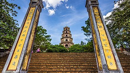 Tall yellow columns at the entrance of the Thien Mu Pagoda in Vietnam