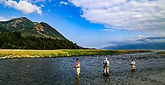 Boys fly fishing for salmon on Resurrection Creek in Hope, Alaska