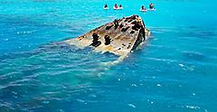 Group Jet Skiing near a Shipwreck in the Clear Turquoise Waters, Bermuda