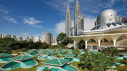 View of the cityscape with the modern archiecture Twin Towers and Mosque in Kuala Lumpur, Malaysia
