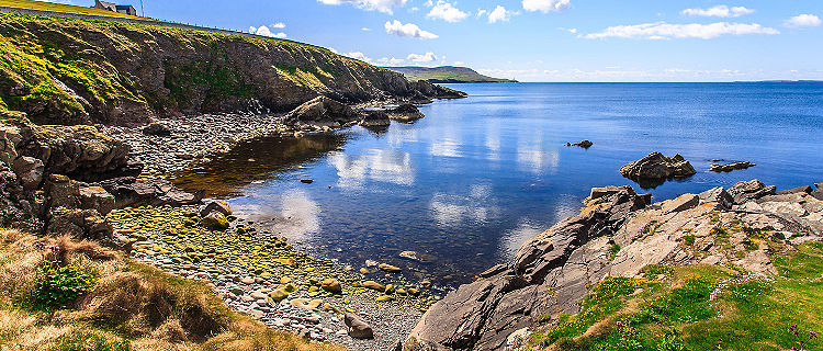 Coast terrain and a secluded bay in Scotland
