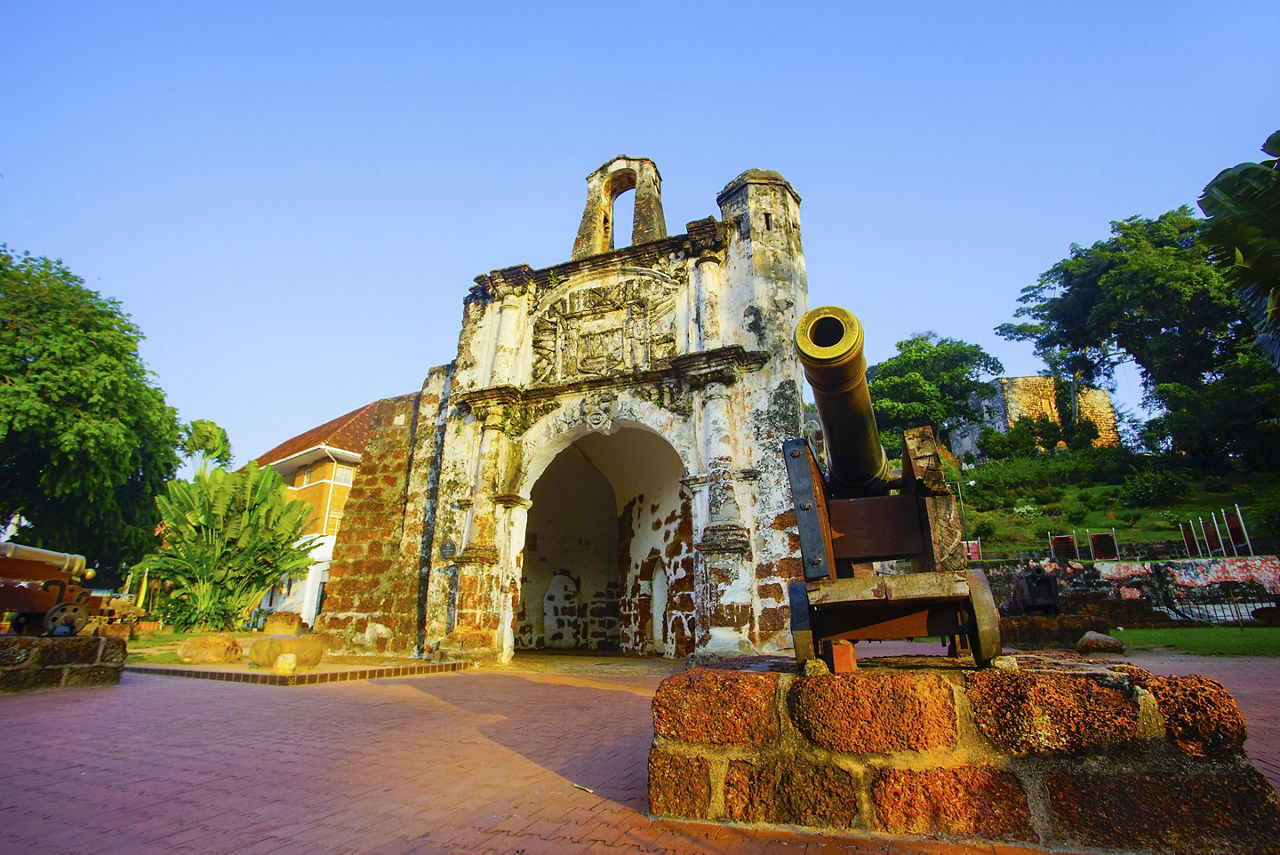 Remains of A Famosa, a former Portuguese fortress, with a cannon, in Malacca, Malaysia