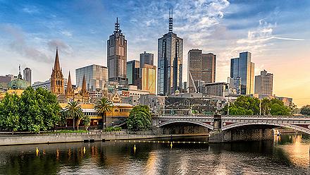 View of the skyline and a bridge crossing over the river in Melbourne, Australia