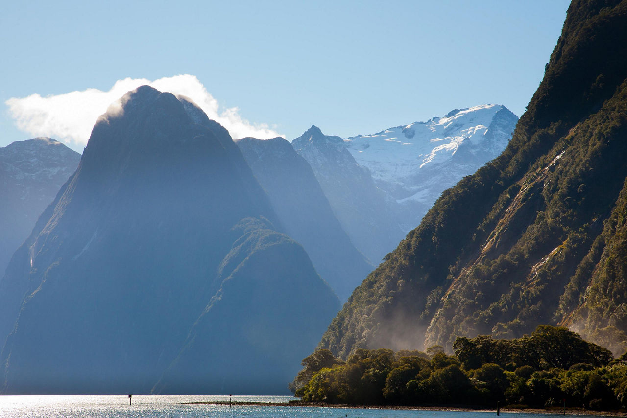 Mountain peaks on a cloudy day in Milford Sound, New Zealand