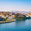 View of the waterfront coast with mountains in Muscat, Oman