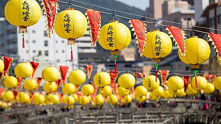 Yellow lanterns lined up along the Megane bashi, or glass bridge, in Nagasaki, Japan