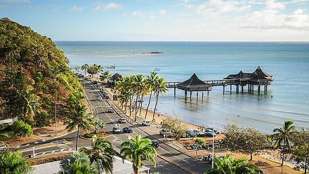 Views of Noumea's streets and city along the beaches with tikis over the water