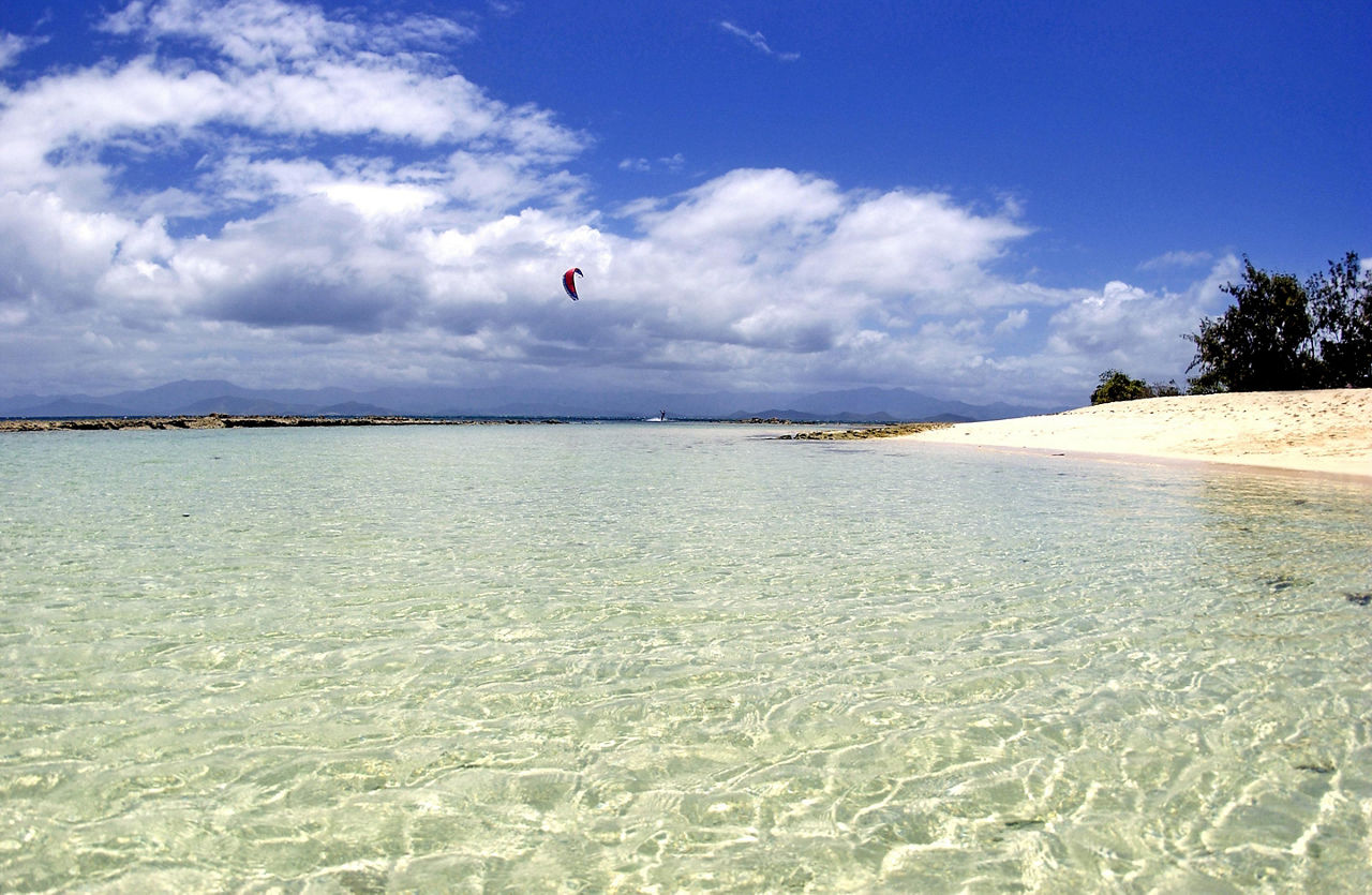 Kiteboarding over the beach in Noumea, New Caledonia