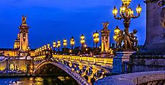 Pont Alexandre III bridge at night with lights in Paris. Europe