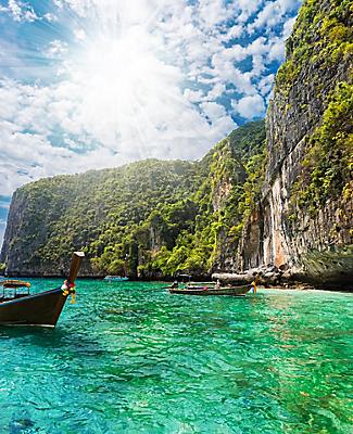 Beautiful landscape with traditional boat on the sea in Phi Phi Lee region in Phuket, Thailand