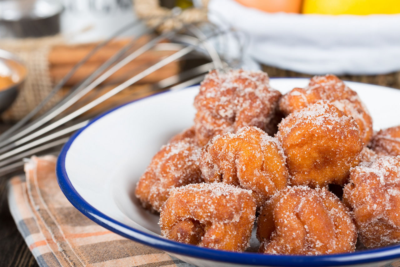 Homemade fritters topped with sugar