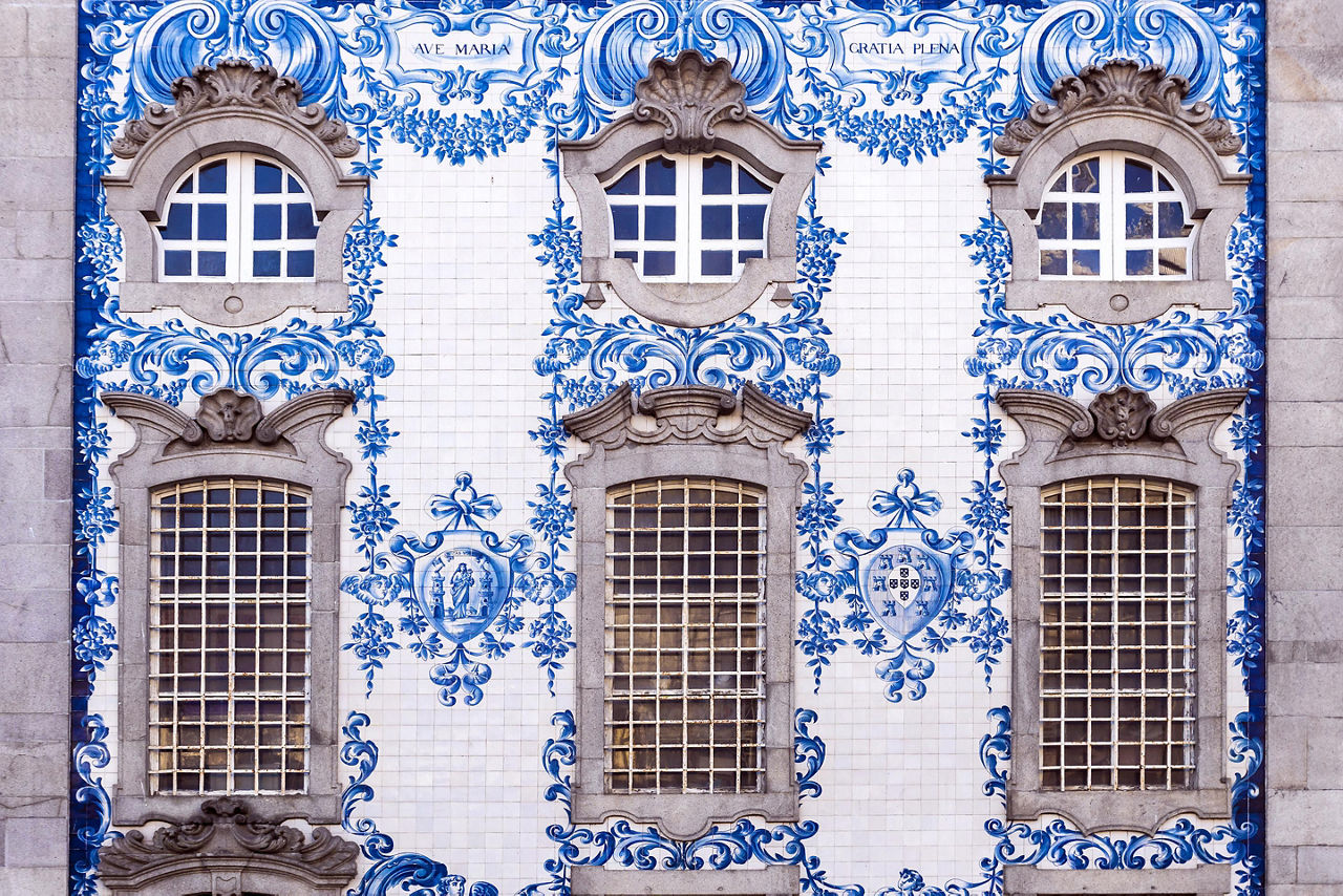 Traditional historic facade in Porto, Portugal, decorated with blue hand painted tin-glazed tiles