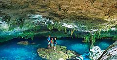 Family Exploring the Cenote Azul in Costa Maya