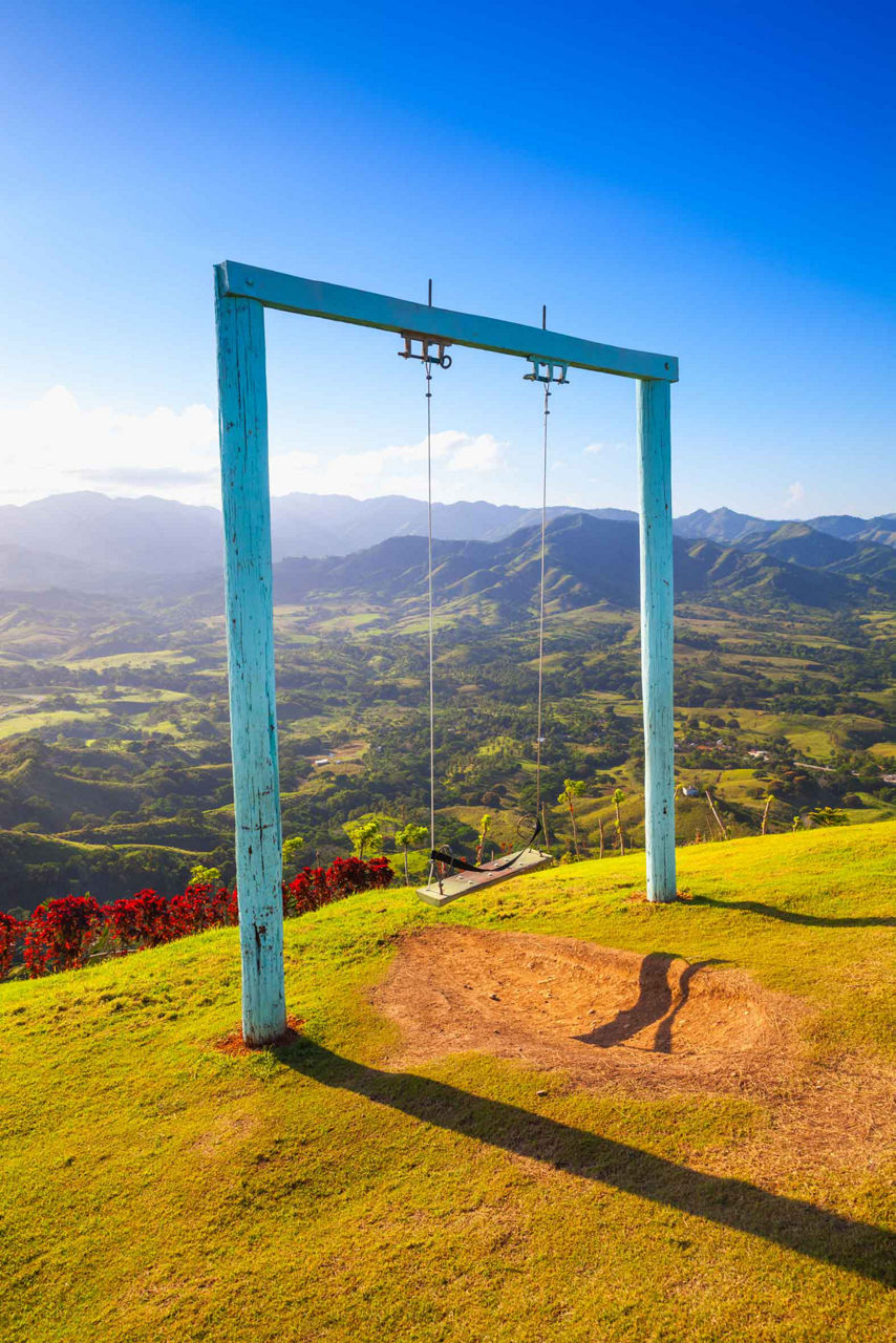 Views from the top of Montana Redonda in Punta Cana, Dominican Republic where you can find a swing set on the mountain top