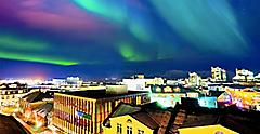 View of the northern lights from the city center in Reykjavik. Iceland.