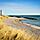 Skagen, Denmark, A beach with lighthouse in distance