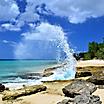 Wave Crashing Against Rocks on a Sunny Day in Frederiksted Beach, St. Croix, U.S. Virgin Islands
