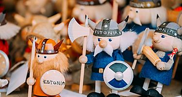 A variety of wooden souvenir viking dolls for sale in Estonia
