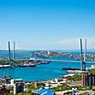 Day time cityscape of Vladivostok, Russia, with Zolotoy Golden Bridge in the background