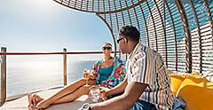 Couple Relaxing and Having a Drink at Cabana Suite Sun Deck