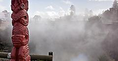 Maori Totem standing in front of hot spring. Australia