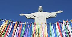 Christ the Redeemer statue in view behind Rio Carnival ribbons. Brazil.