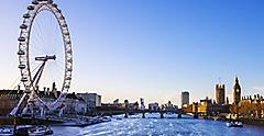 View of the London Eye ferris wheel at sunrise near the River Thames. London