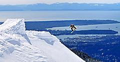 Snowboarder launching of a jump. Canada.