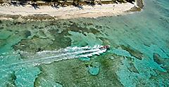 Helicopter view of a Caribbean speed boat tour. The Caribbean.