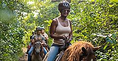 Eastern Caribbean, Woman Enjoying Horseback Riding 